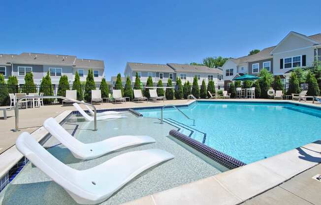 our apartments have a resort style pool with chaise lounge chairs