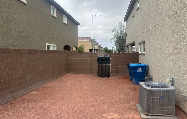 NW!! Gated!! Built 2023!!!! Corner Lot!! Low Maintenance Desert Landscape Front!! Patio & Synthetic Grass in Back!! Pet Friendly!!