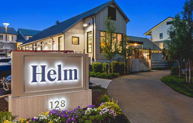 A sign that says Helm in front of a building.
