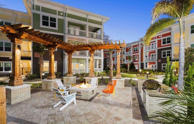 M South Apartments Patio with Firepit and BBQ Area