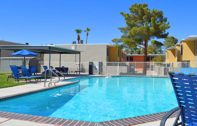 a swimming pool at a resort with chairs and umbrellas  Region2 at Summer Meadows, Nevada