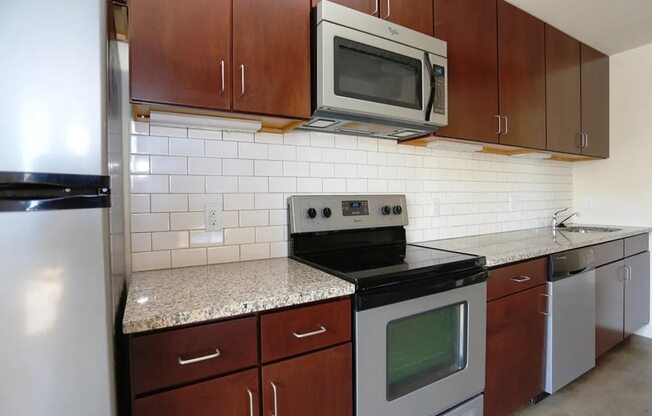 a kitchen with a stove and a microwave