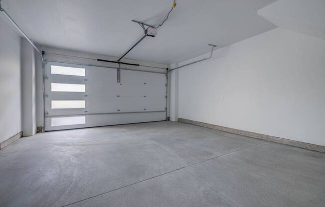 A large empty room with a concrete floor and white walls. at Reveal, Utah