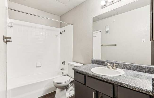 Well-appointed bathroom with shower/tub combo at Laurels of Sendera apartments in Arlington, TX