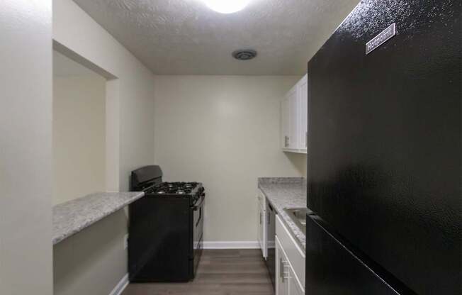 This is a photo of the kitchen in the 543 square foot A-style, 1 bedroom, 1 bath apartment at Blue Grass Manor Apartments in Erlanger, KY.