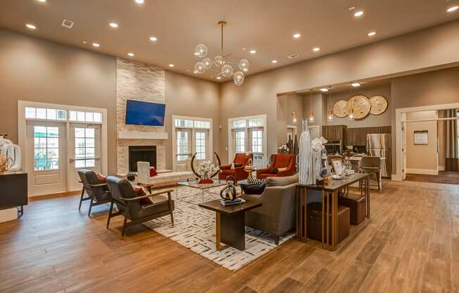 a large living room with a fireplace and hardwood floors