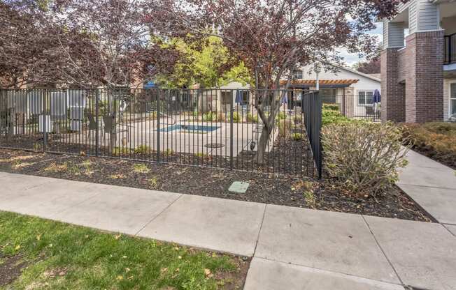 our apartments have a yard with a fence and a swimming pool