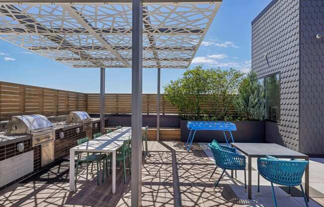 a patio with tables and chairs and a pergola