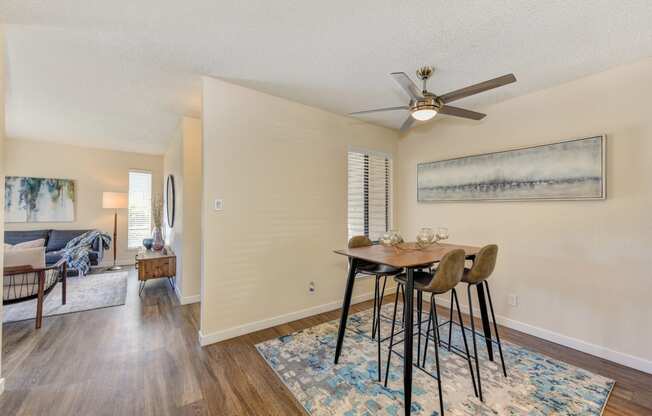 Dining Area, Ceiling Fan, Hardwood Inspired Floor, and Rug at Silverstone Apartments, Davis ,95618