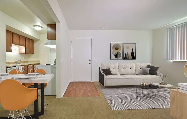 Living Room With Kitchen View at Perry Place Apartments, Grand Blanc, MI