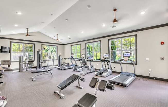 Spacious gym with a variety of equipment and a ceiling fan at Sterling Creek at Richmond Hill, Richmond Hill, Georgia 