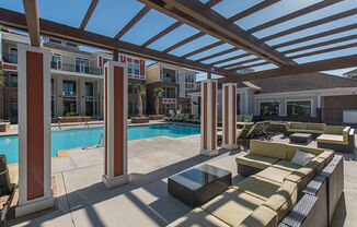 a pool and lounge area at the residences at city center apartments at Nexus at Sandhill, Columbia, 29229