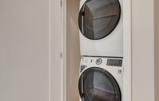 a washer and dryer in a small laundry room