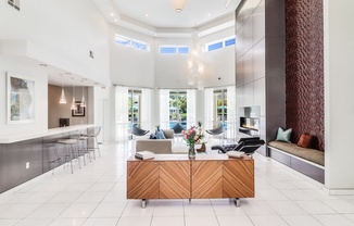 a large living room with a fireplace and a large table with a couch and chairs at Plantation Crossing, Lafayette