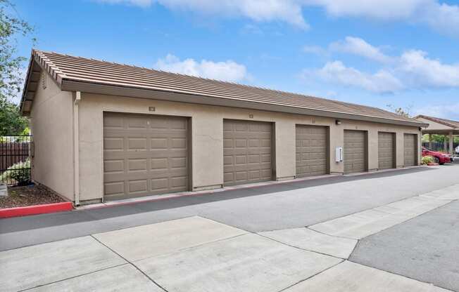 a row of garage doors on the side of a building