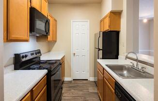 Stainless Steel Sink With Faucet In Kitchen at Park Summit Apartments, Decatur, Georgia