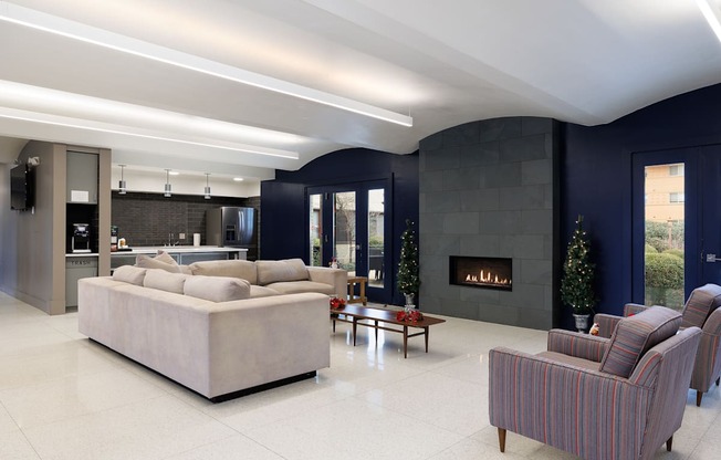 A modern living room with a fireplace and a large couch.