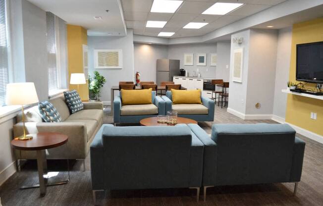 a living room filled with furniture and a flat screen tv