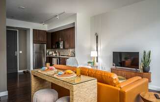 a living room with a couch and a table