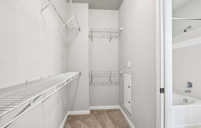 A white bathroom with a walk-in shower and a white bathtub.