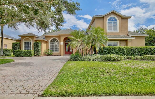Stunning 4/3 Pool Home with a Bonus Room and a 2 Car Garage in the Desirable Cambridge Crossing - Winter Garden!