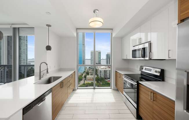 a kitchen with white countertops and wooden cabinets