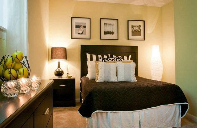 Bedroom with a queen size bed at Emory Woods Apartments, Durham, NC.