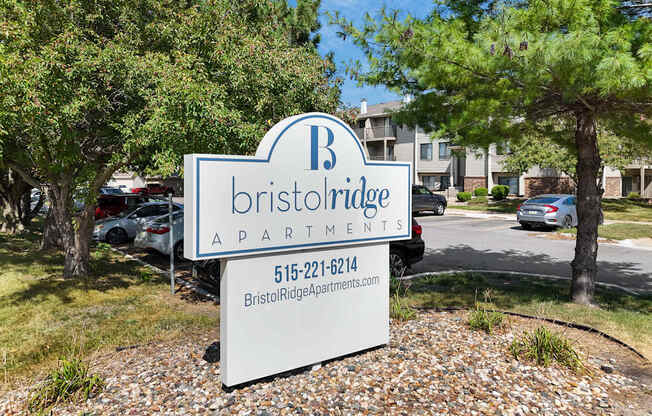 A sign for Bristol Ridge Apartments with a phone number on it.