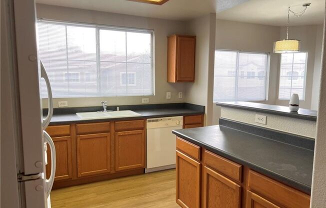 Bright 2-Bed Condo with Dual Balconies, Garage & Community Amenities!