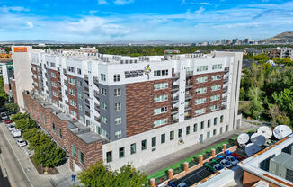 a large white building with many windows and a sign on the side of the building that says