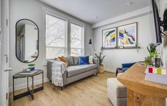 a living room with a couch and a table