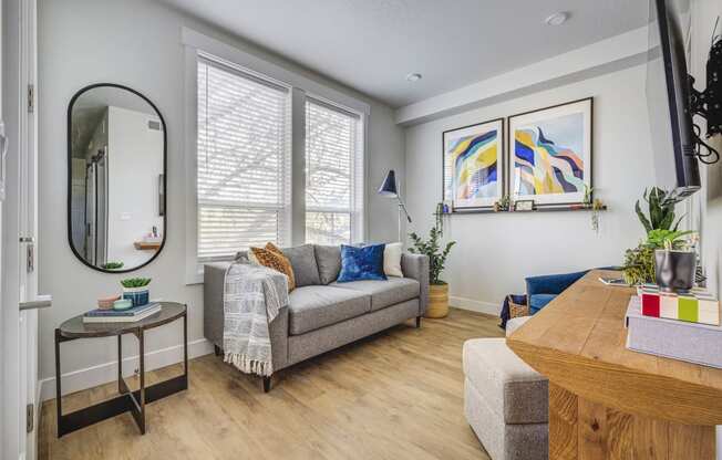 a living room with a couch and a table