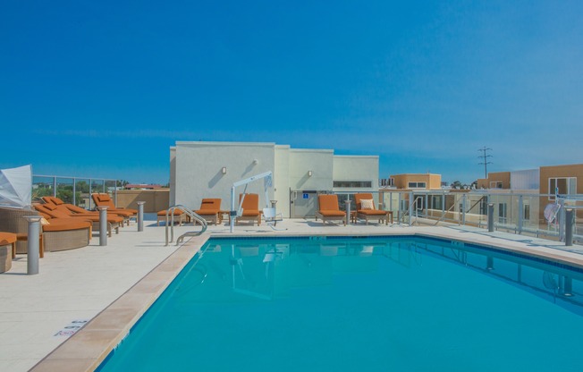 Lavish pool & spa with lounge cabanas