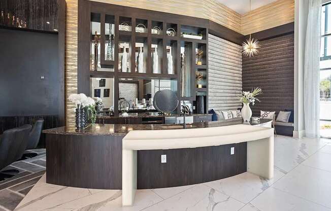 A reception area with a white bench and a dark brown cabinet.
