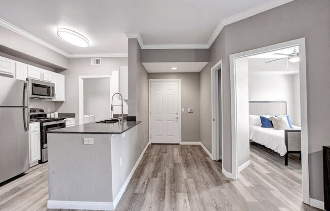 a kitchen and bedroom in a 555 waverly unit