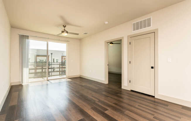 Living Room with Balcony and Hard Surface Flooring