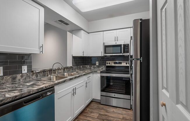 a large kitchen with stainless steel appliances