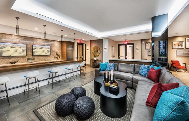 Clubroom with bar seating and TVs for relaxed social time.