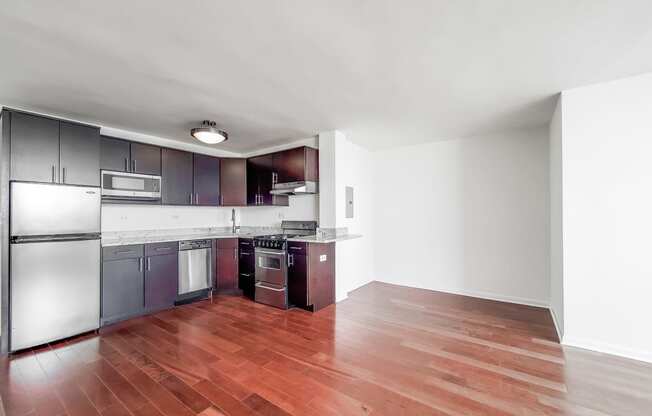 a kitchen and living room in a 555 waverly unit