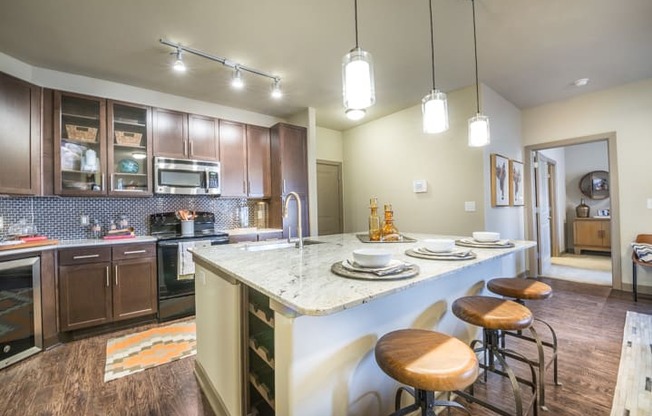 Gourmet Kitchen With Island at Aviator West 7th, Fort Worth