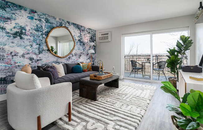 a living room with couches and a table at The Heights Apartments, Ohio