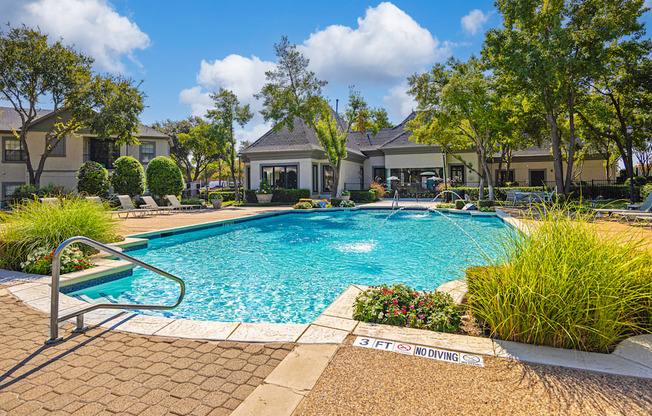 a swimming pool with a building in the background