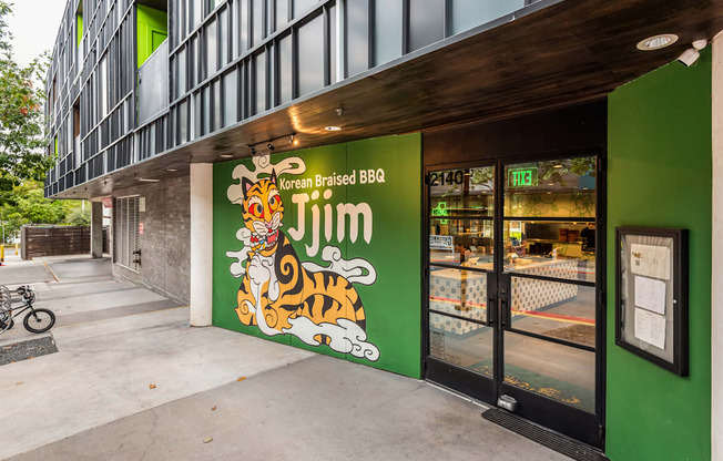 A green building with a tiger on the sign.