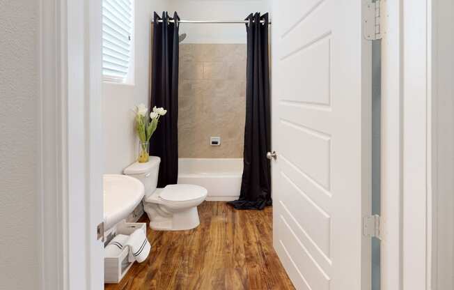 a bathroom with a toilet sink and bathtub