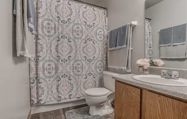 Bathroom Featuring Vanity & Wood-Style Flooring