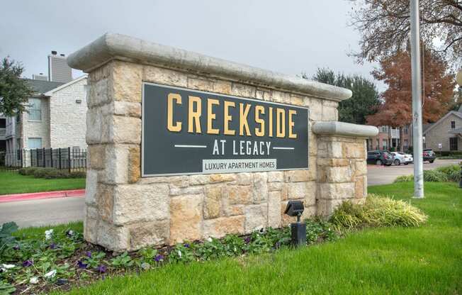 a sign at lead in front of a buildingat Creekside at Legacy, Plano