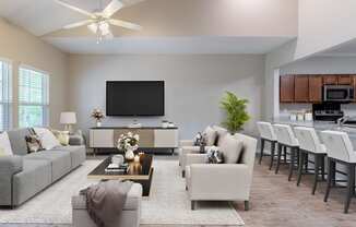 a living room with couches and chairs and a kitchen with a tv