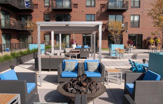 Outdoor fire pit with surrounding lounge furniture