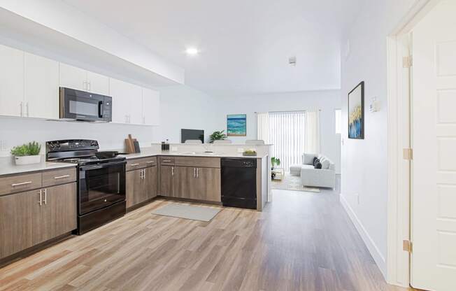 a kitchen and living room in a 555 waverly unit
