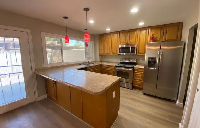 Inviting 3-Bed, 2.5-Bath Townhome: Newly Upgraded with Luxury Vinyl Plank Flooring, Stainless Steel Appliances, Ample Storage, and Access to Community Pool